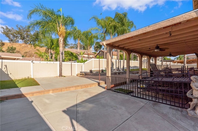 7459 Melanie Ct, Highland, CA 92346 - fenced backyard with a ceiling fan and a patio area