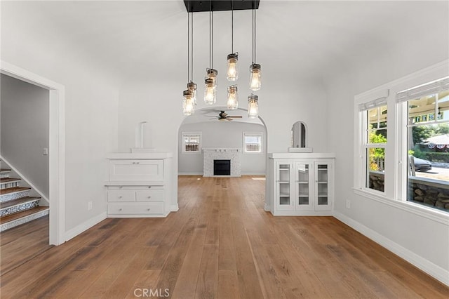 2311 6th St, La Verne, CA 91750 - unfurnished living room with a ceiling fan, a fireplace, hardwood / wood-style floors, and stairway