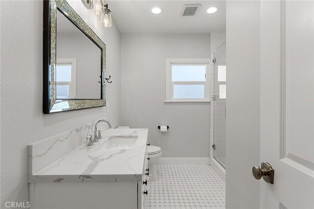 2311 6th St, La Verne, CA 91750 - bathroom with healthy amount of natural light, tile patterned floors, vanity, a stall shower, and recessed lighting