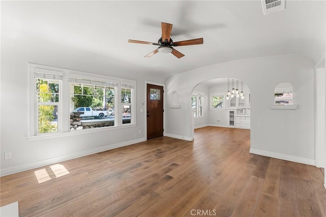 2311 6th St, La Verne, CA 91750 - foyer entrance featuring a ceiling fan, wood-type flooring, arched walkways, and a chandelier
