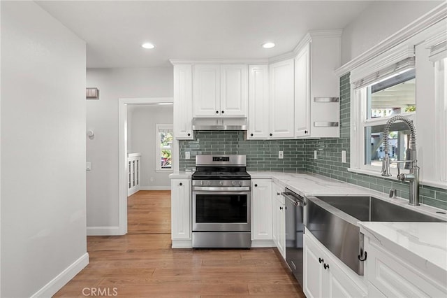 2311 6th St, La Verne, CA 91750 - kitchen featuring stainless steel appliances, under cabinet range hood, white cabinets, and recessed lighting