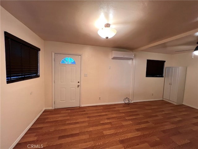 583 S Calle, Abronia, Palm Springs, CA 92264 - foyer featuring a wall mounted AC and wood finished floors