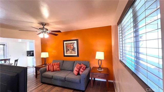 583 S Calle, Abronia, Palm Springs, CA 92264 - living area featuring plenty of natural light, a ceiling fan, and wood finished floors