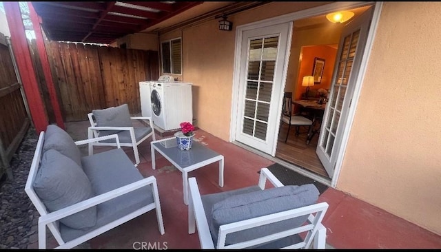 583 S Calle, Abronia, Palm Springs, CA 92264 - view of patio / terrace with washing machine and dryer and an outdoor hangout area