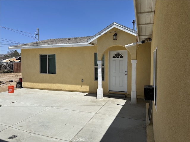 23610 David Ln, Moreno Valley, CA 92557 - property entrance featuring stucco siding and a patio area