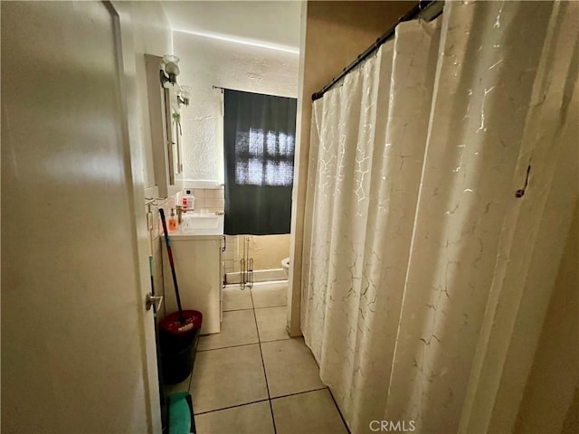 729 W Holt Blvd, Ontario, CA 91762 - bathroom featuring vanity, tile patterned floors, and curtained shower