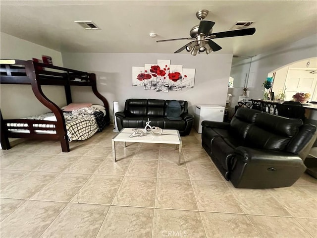 729 W Holt Blvd, Ontario, CA 91762 - living area with tile patterned flooring, arched walkways, and ceiling fan