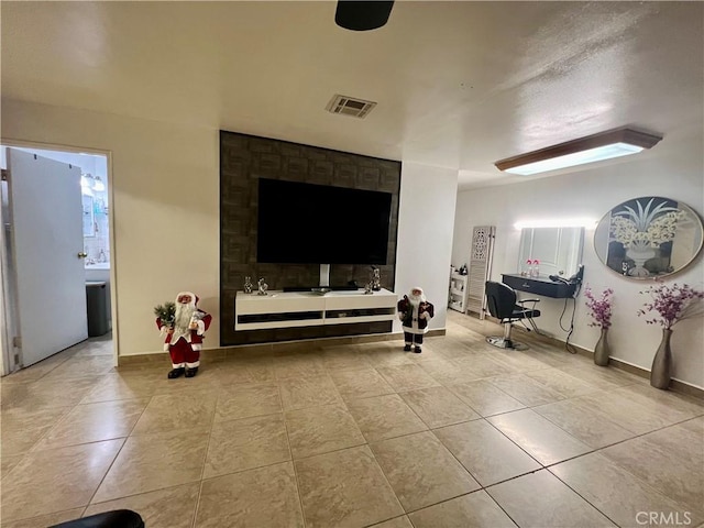 729 W Holt Blvd, Ontario, CA 91762 - living room featuring tile patterned floors and baseboards