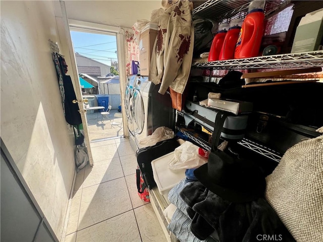 729 W Holt Blvd, Ontario, CA 91762 - spacious closet featuring separate washer and dryer and tile patterned flooring