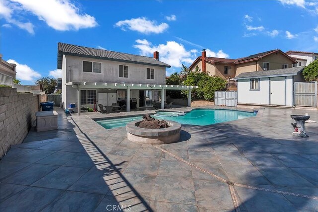 1010 W Yorktown Ave, Montebello, CA 90640 - view of swimming pool featuring a fenced backyard, a storage shed, a pergola, a patio, and a pool with connected hot tub