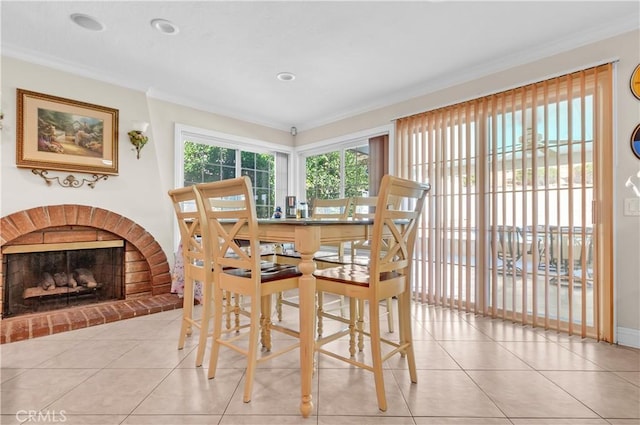 1010 W Yorktown Ave, Montebello, CA 90640 - dining room with crown molding, tile patterned floors, and a brick fireplace