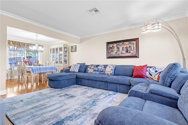 1010 W Yorktown Ave, Montebello, CA 90640 - living area with a chandelier, crown molding, and wood finished floors