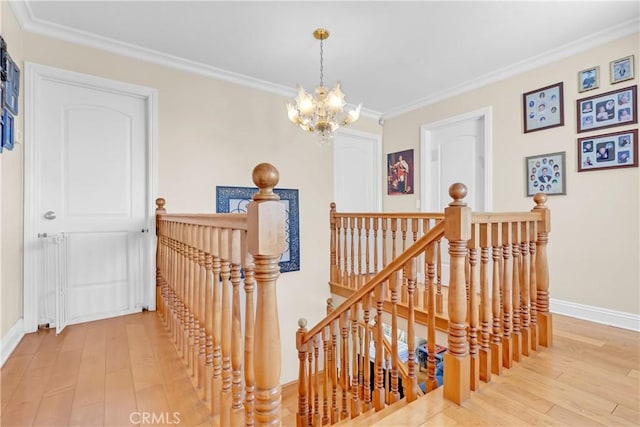 1010 W Yorktown Ave, Montebello, CA 90640 - stairs featuring wood-type flooring, a chandelier, and ornamental molding