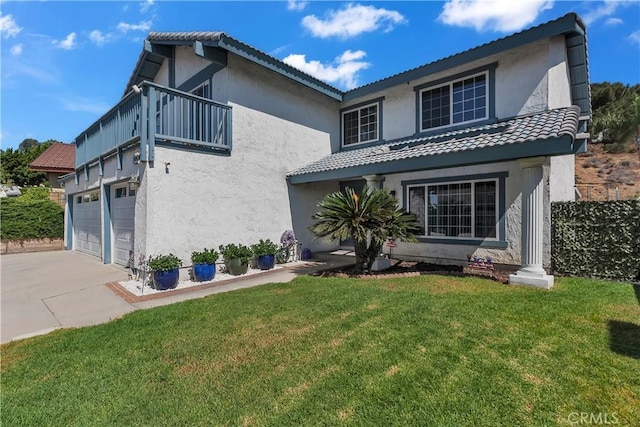 1010 W Yorktown Ave, Montebello, CA 90640 - view of front of property featuring a front yard, a garage, stucco siding, and concrete driveway
