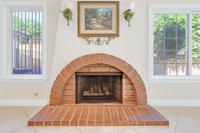 1010 W Yorktown Ave, Montebello, CA 90640 - detailed view of baseboards and a brick fireplace