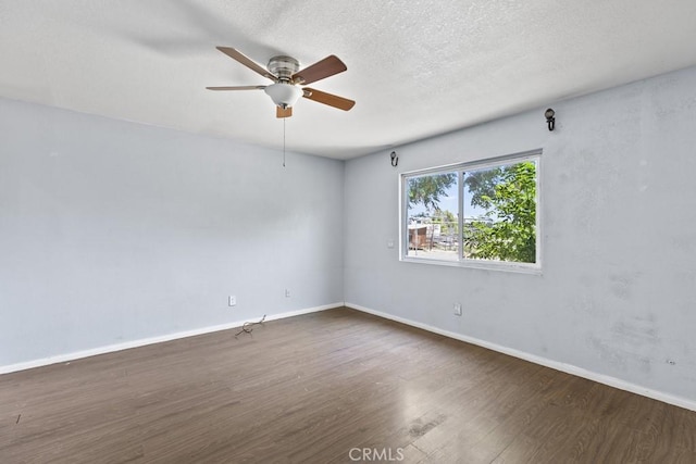 5956 Marlatt St, Jurupa Valley, CA 91752 - unfurnished room with dark wood-type flooring, a ceiling fan, and a textured ceiling