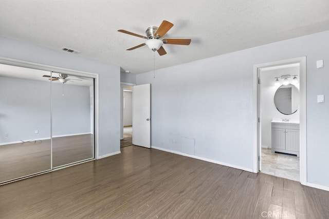 5956 Marlatt St, Jurupa Valley, CA 91752 - unfurnished bedroom with wood finished floors, a closet, a ceiling fan, and ensuite bathroom