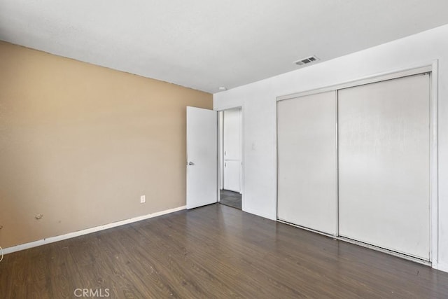 5956 Marlatt St, Jurupa Valley, CA 91752 - unfurnished bedroom with wood finished floors and a closet