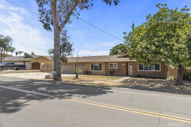 5956 Marlatt St, Jurupa Valley, CA 91752 - single story home featuring concrete driveway, a garage, and a gate