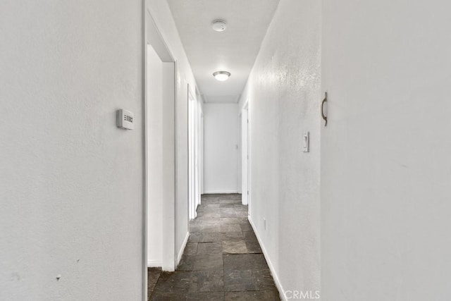 5956 Marlatt St, Jurupa Valley, CA 91752 - corridor with stone finish floors and a textured wall