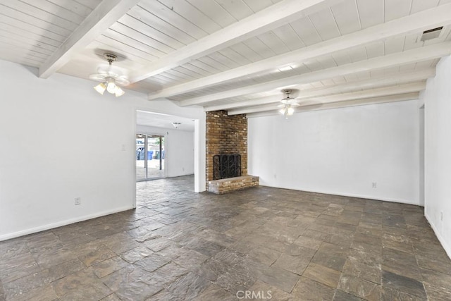 5956 Marlatt St, Jurupa Valley, CA 91752 - unfurnished living room with ceiling fan, stone tile flooring, a fireplace, and a wood ceiling with exposed beams
