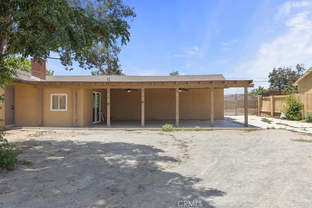 5956 Marlatt St, Jurupa Valley, CA 91752 - rear view of house featuring a ceiling fan, a chimney, and a patio area