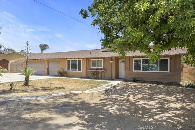 5956 Marlatt St, Jurupa Valley, CA 91752 - ranch-style home with driveway, board and batten siding, and a garage