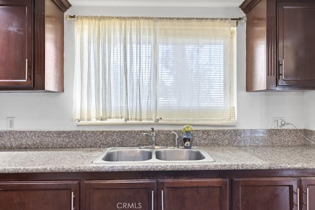 5956 Marlatt St, Jurupa Valley, CA 91752 - kitchen featuring dark brown cabinetry, plenty of natural light, and light countertops