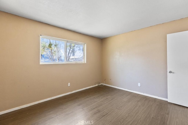 5956 Marlatt St, Jurupa Valley, CA 91752 - unfurnished room with dark wood-style flooring and baseboards