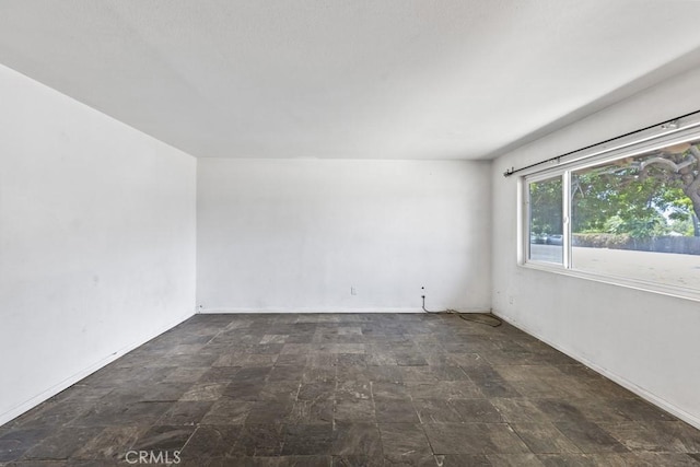5956 Marlatt St, Jurupa Valley, CA 91752 - empty room with stone finish flooring and baseboards
