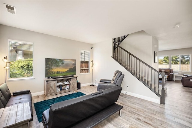 33883 Vinca Ln, Murrieta, CA 92563 - living room with stairway, plenty of natural light, and wood finished floors