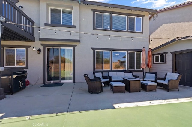 33883 Vinca Ln, Murrieta, CA 92563 - back of house with an outdoor hangout area, stucco siding, and a patio area