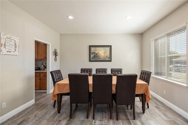 33883 Vinca Ln, Murrieta, CA 92563 - dining room featuring light wood-style flooring and recessed lighting