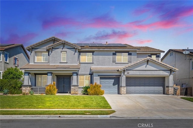 33883 Vinca Ln, Murrieta, CA 92563 - view of front of house featuring driveway, a yard, a porch, and stucco siding
