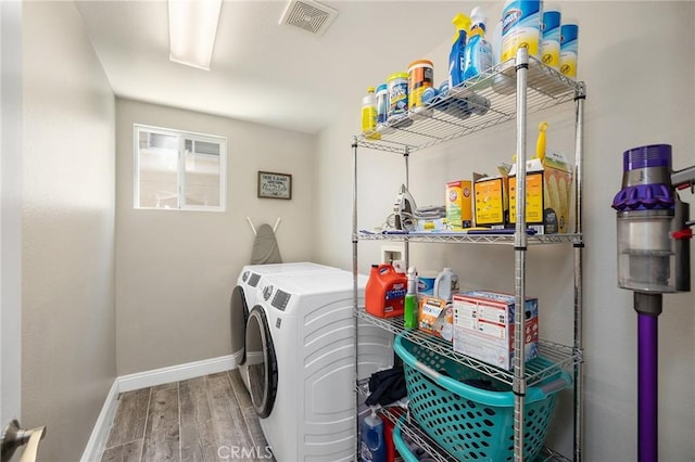 33883 Vinca Ln, Murrieta, CA 92563 - washroom featuring washer and clothes dryer and wood finished floors