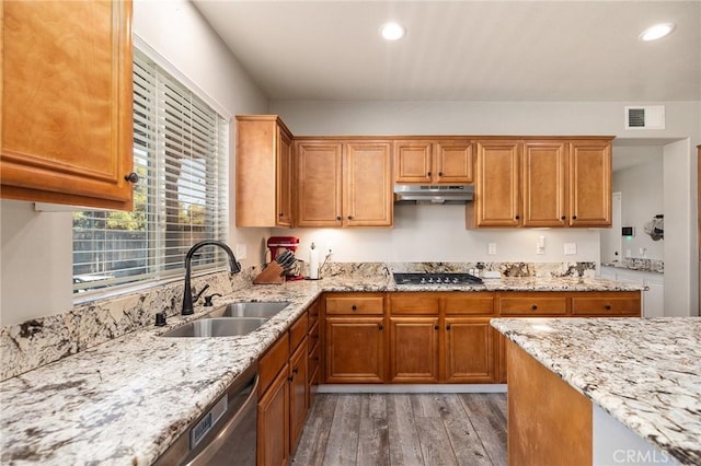33883 Vinca Ln, Murrieta, CA 92563 - kitchen with under cabinet range hood, appliances with stainless steel finishes, light wood-type flooring, light stone countertops, and recessed lighting