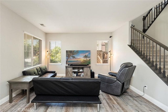 33883 Vinca Ln, Murrieta, CA 92563 - living area featuring wood finished floors and stairway