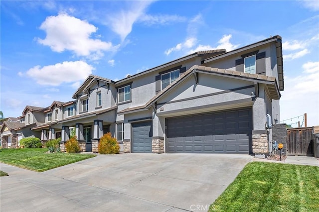 33883 Vinca Ln, Murrieta, CA 92563 - view of front facade with stone siding, driveway, stucco siding, and a garage