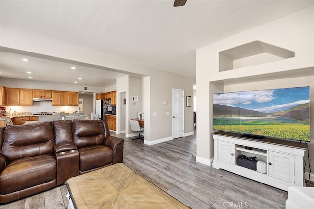 33883 Vinca Ln, Murrieta, CA 92563 - living area featuring wood finished floors and recessed lighting