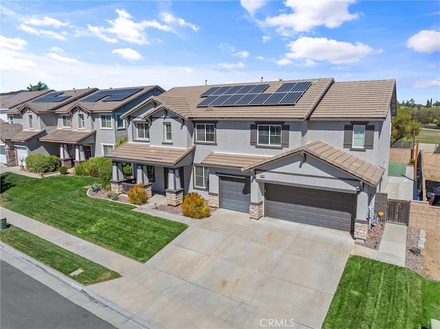 33883 Vinca Ln, Murrieta, CA 92563 - view of front facade featuring stucco siding, driveway, roof mounted solar panels, a garage, and stone siding
