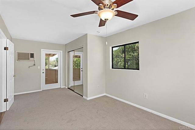 3976 N Granada Ave, Spring Valley, CA 91977 - unfurnished bedroom with a wall mounted air conditioner, access to exterior, carpet floors, and a ceiling fan