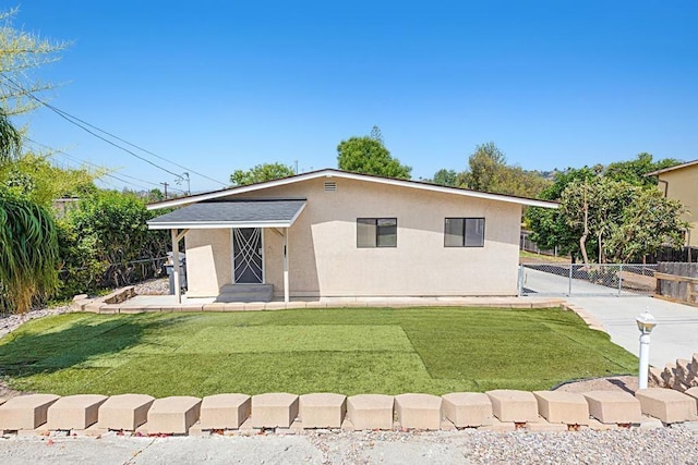 3976 N Granada Ave, Spring Valley, CA 91977 - view of front facade with stucco siding and a gate
