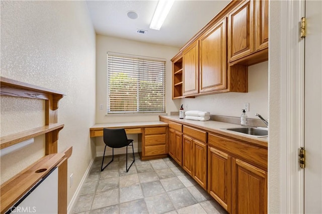 822 Noddy Ct, Arroyo Grande, CA 93420 - office area with built in desk and stone finish flooring