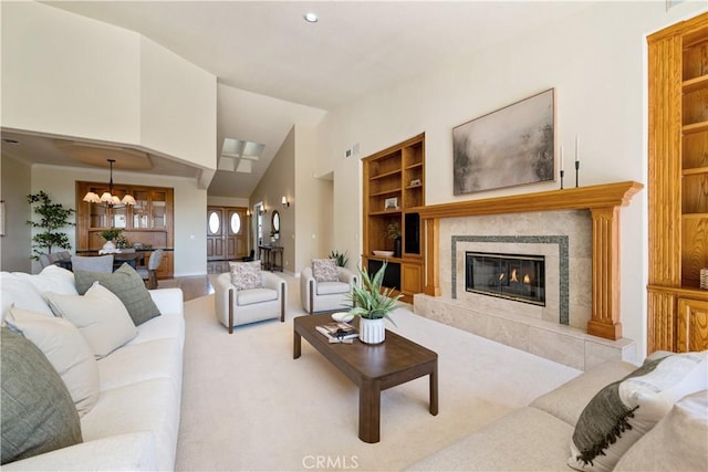 822 Noddy Ct, Arroyo Grande, CA 93420 - living area featuring built in features, a chandelier, a high end fireplace, vaulted ceiling, and carpet