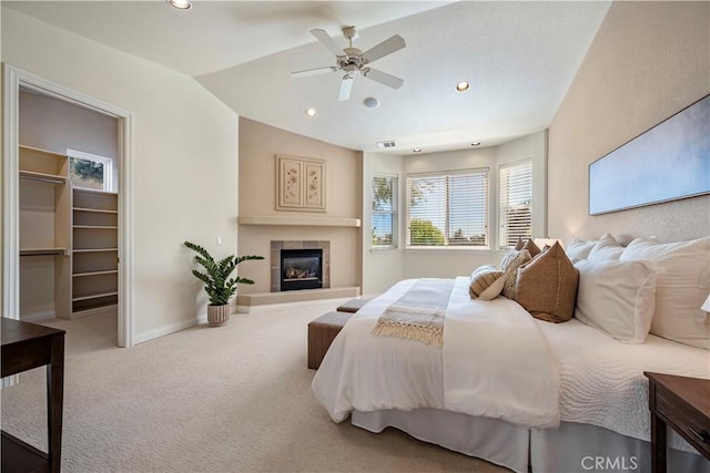 822 Noddy Ct, Arroyo Grande, CA 93420 - carpeted bedroom featuring vaulted ceiling, a tile fireplace, recessed lighting, a ceiling fan, and a spacious closet