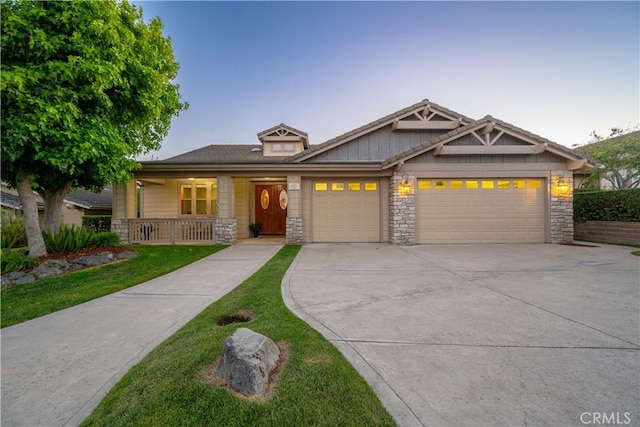 822 Noddy Ct, Arroyo Grande, CA 93420 - craftsman-style house with stone siding, a garage, and covered porch