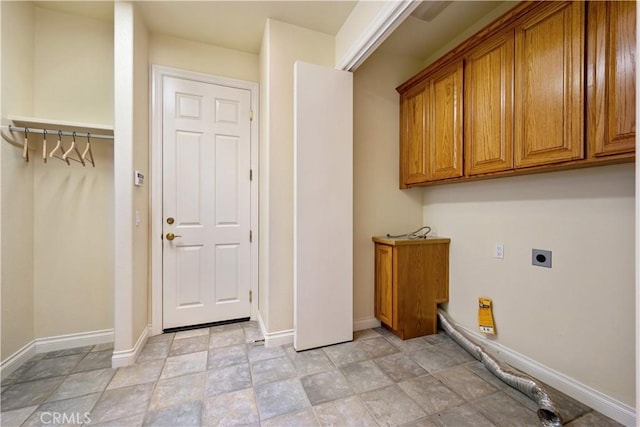 822 Noddy Ct, Arroyo Grande, CA 93420 - laundry room featuring hookup for an electric dryer, stone finish flooring, and cabinet space
