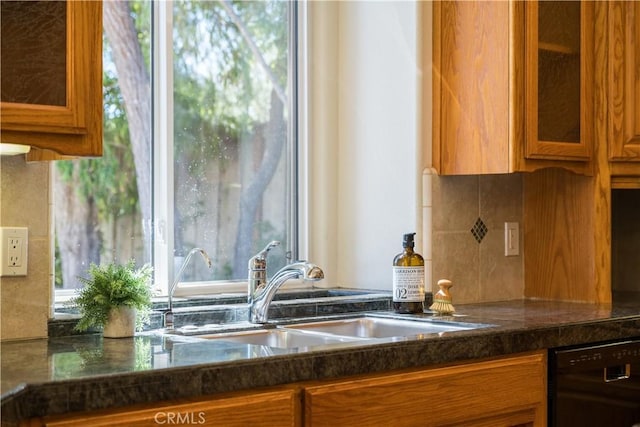 822 Noddy Ct, Arroyo Grande, CA 93420 - kitchen with black dishwasher, brown cabinets, glass insert cabinets, and backsplash