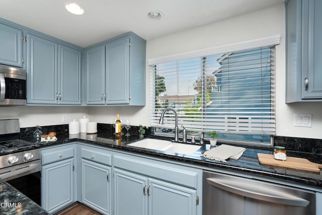 1051 Thomas Ln, Ventura, CA 93003 - kitchen with stainless steel appliances, dark stone countertops, and recessed lighting
