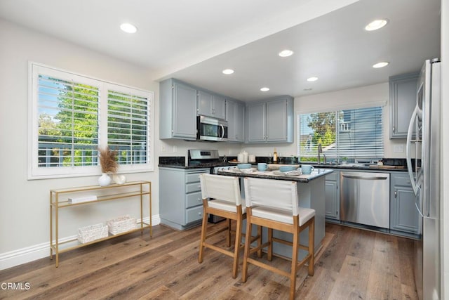 1051 Thomas Ln, Ventura, CA 93003 - kitchen with stainless steel appliances, gray cabinetry, dark countertops, and recessed lighting
